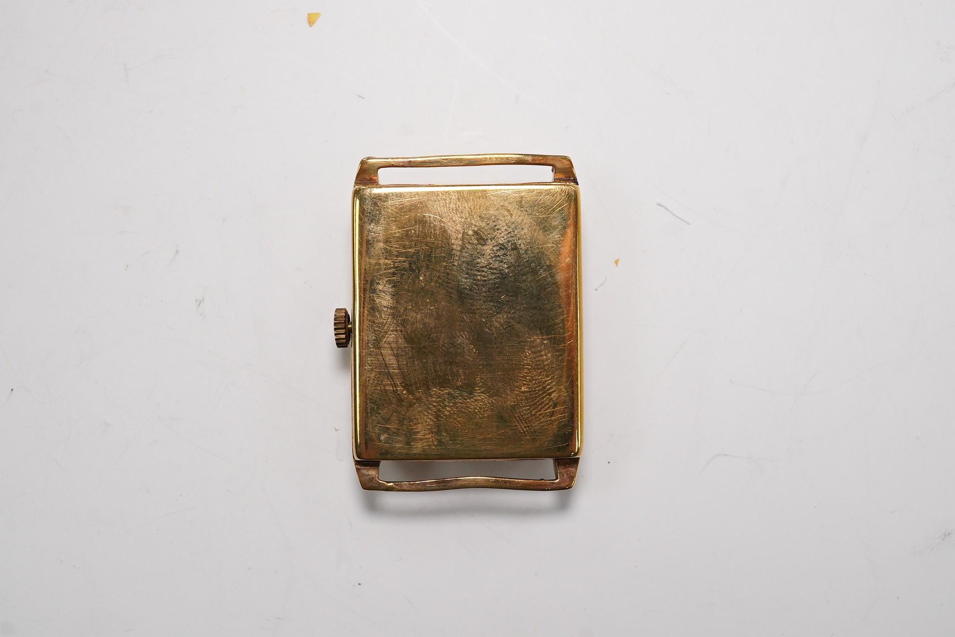 A gentleman's 9ct gold rectangular dial, manual wind wrist watch, retailed by Bravington, case diameter 26mm, no strap. Condition - poor to fair